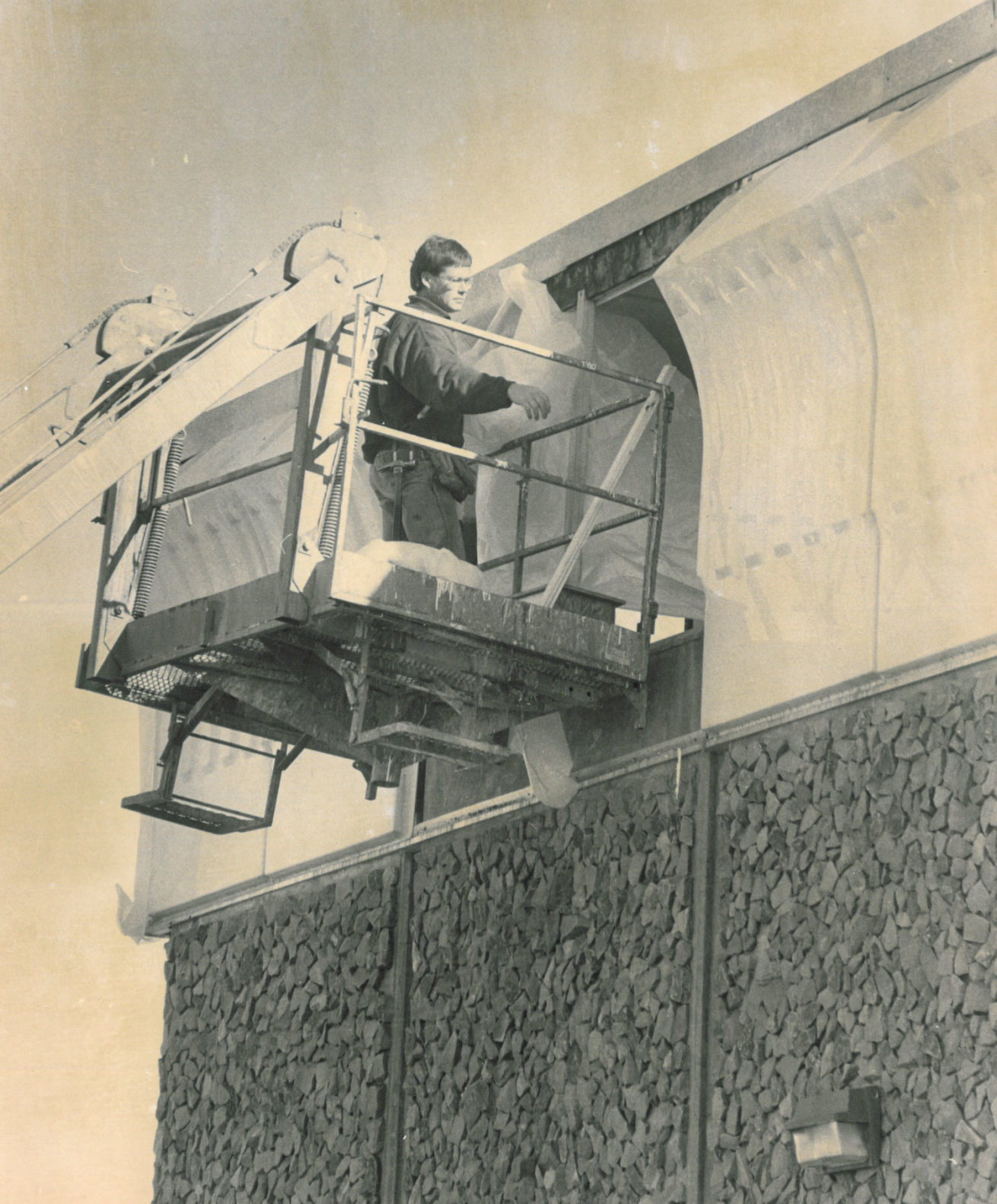 Worker covers damaged windows